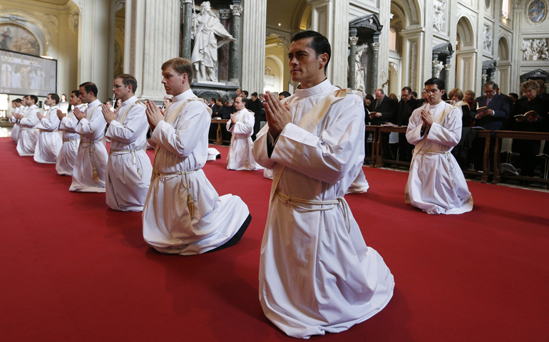 New priests of the Legionaries of Christ kneel during their ordination at the Basilica of St. John Lateran in Rome Dec. 14. (CNS/Paul Haring)