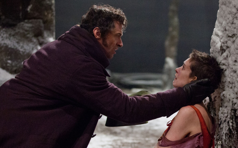Hugh Jackman and Anne Hathaway star as Jean Valjean and Fantine, respectively, in "Les Miserables," the big-screen adaptation of the long-running stage show. (CNS/Universal Studios)