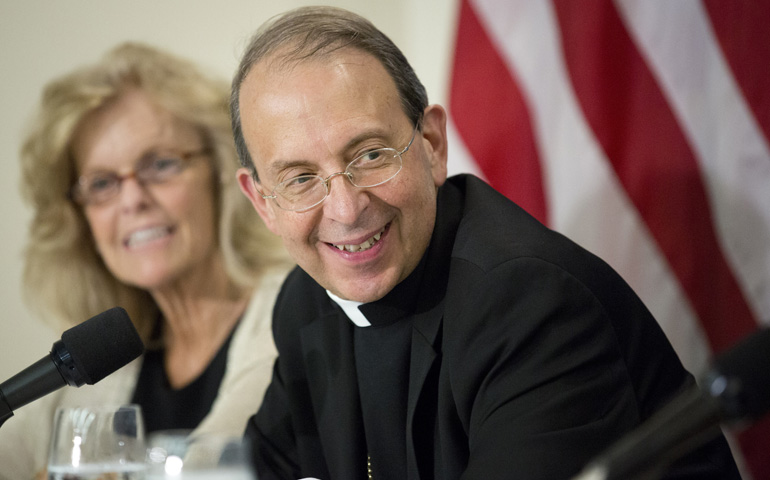 Archbishop William Lori of Baltimore, chairman of the U.S. bishops' Ad Hoc Committee for Religious Liberty, joins other religious leaders at a news conference regarding the Health and Human Services contraceptive mandate Tuesday at the National Press Club in Washington. (CNS/Tyler Orsburn)