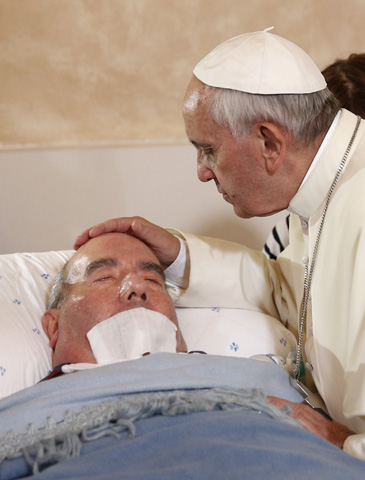 Pope Francis blesses a sick man Sept. 22 inside the Basilica of Our Lady of Bonaria in Cagliari, Sardinia. (CNS/Paul Haring)