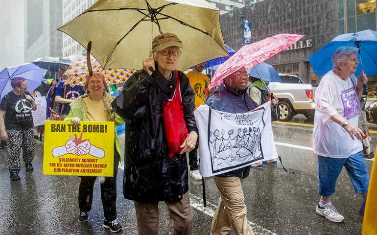 Maryknoll Sr. Jean Fallon, 87, left, marches June 10 with fellow Maryknoll Sr. Elizbaeth Zwareva near the United Nations prior to the start of the June 15-July 7 session. (Provided photo)