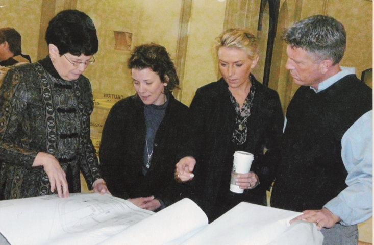 In 2007, Margaret Lima, left, goes over plans for the $1 million church renovation at Guardian Angels, with architect Susan Richards Johnson; Sara Staten, project manager; and Kelly Lynch, job site superintendent.