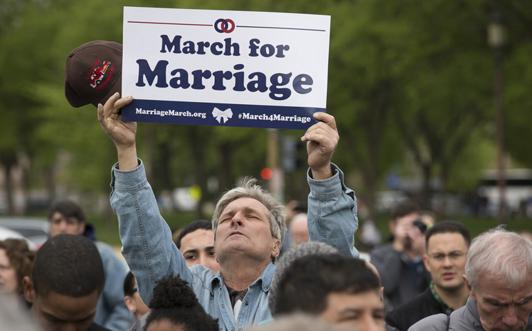 A man holds a sign supporting traditional marriage Saturday near Capitol Hill in Washington during the third annual March for Marriage. (CNS/Tyler Orsburn) 