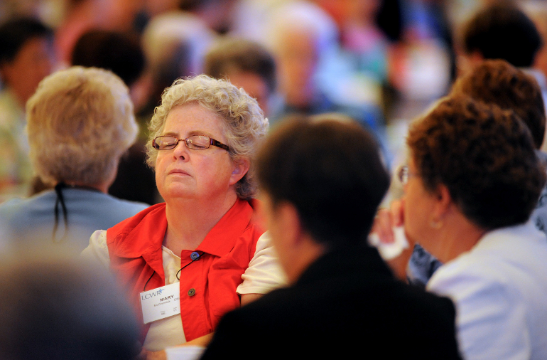 Ursuline Sr. Mary McCormick pauses during a moment of reflection Thursday at the Leadership Conference of Women Religious assembly in St. Louis. (CNS photo/Sid Hastings)