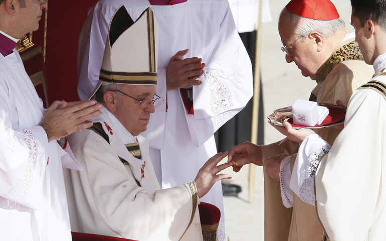 Pope Francis receives his ring from Cardinal Angelo Sodano, dean of the College of Cardinals, on Tuesday during his inaugural Mass in St. Peter's Square at the Vatican. (CNS/Paul Haring) 