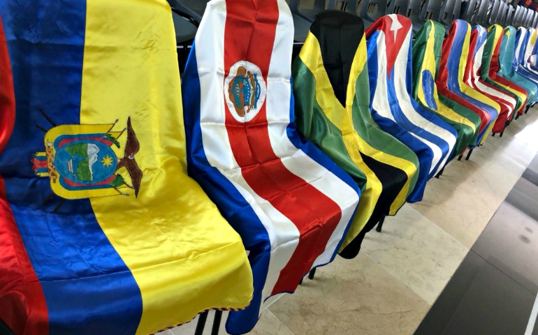 Flags from every Latin American country line the room during the Aug. 27-29 CLAR general assembly. Each country's conference sent leadership and delegates to revamp the organization's three-year plan. (GSR photo/Soli Salgado)