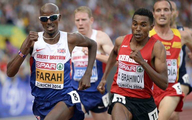 Mo Farah of Great Britain, left, competes in the men's 5,000-meter final Aug. 17, 2014, during the European Athletics Championships in Zurich, Switzerland. (CNS/EPA/Jean-Christophe Bott)