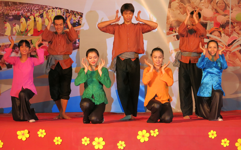 Migrant workers in costume perform a traditional dance as part of the Week of Migrants opening celebration Jan. 5. (Joachim Pham)