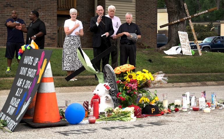 Auxiliary Bishop Edward Rice of St. Louis visited the Ferguson, Mo., site of 18-year-old Michael Brown's shooting and subsequent civil unrest, looting and rioting on Aug. 17. (CNS/St. Louis Review/Teak Phillips)