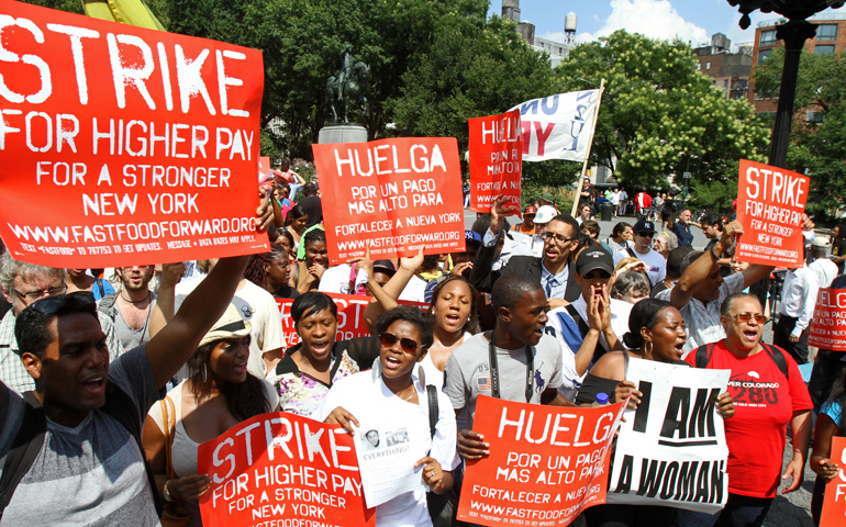 Fast-food workers and their supporters participate at a rally in demand of higher wages July 29 at Union Square in New York. (CNS/Gregory A. Shemitz)