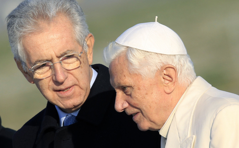 Italian Prime Minister Mario Monti talks with Pope Benedict XVI at Fiumicino airport in Rome in 2011. (CNS/Reuters/Stefano Rellandini)