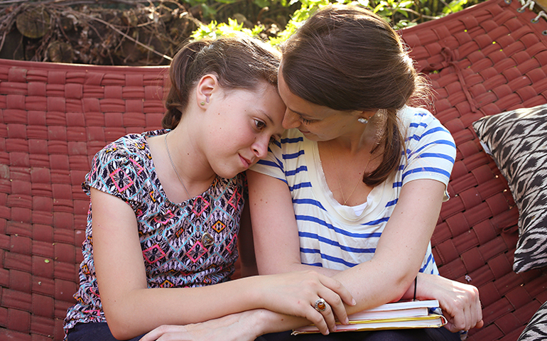 Eliza Lamb and her daughter, Madeline, at their home in the Astoria neighborhood of Queens, N.Y., on Monday. (RNS/Alexander Cohn)