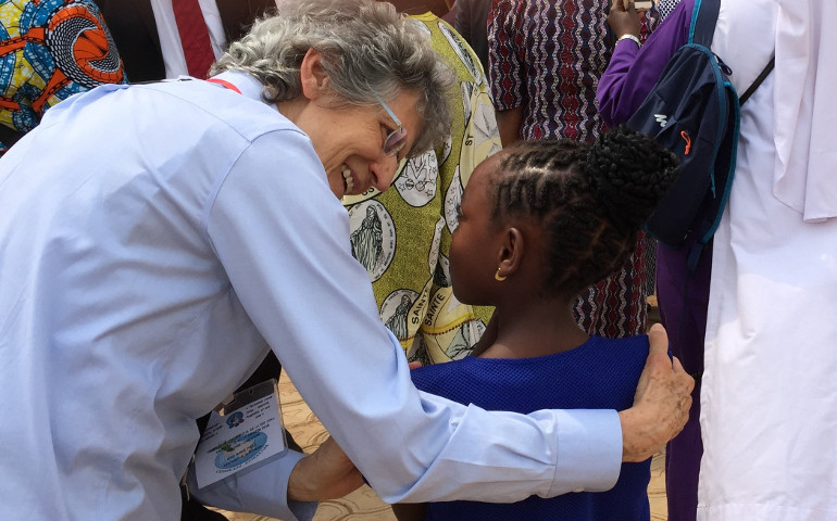 Sr. Marie-Paul Ross talks to a young girl at the Confederation of Major Superiors of Africa and Madagascar symposium in January in Yaounde, Cameroon. (GSR photo / Joyce Meyer)