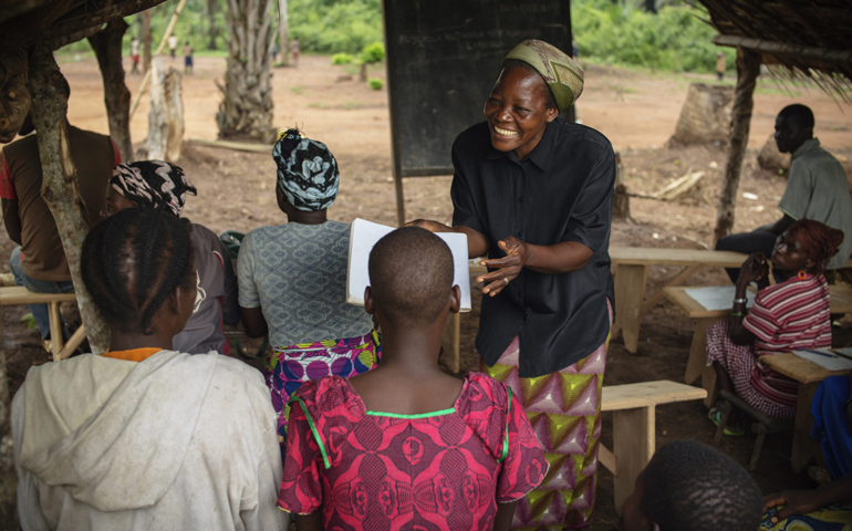 Sr. Angelique Namaika, a member of the Augustine Sisters of Dungu and Doruma, smiles as she instructs a literacy class Aug. 1 in Congo. (CNS/Brian Sokol, courtesy UNHR) 