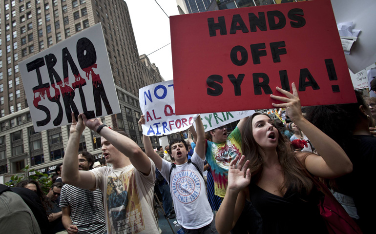 Demonstrators protest against proposed U.S. military action against Syria in Times Square in New York  in 2013. (CNS/Reuters/Carlo Allegri)