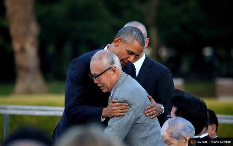U.S. President Barack Obama hugs an atomic bomb survivor Shigeaki Mori as he visits Hiroshima Peace Memorial Park May 27. (Reuters/Carlos Barria)