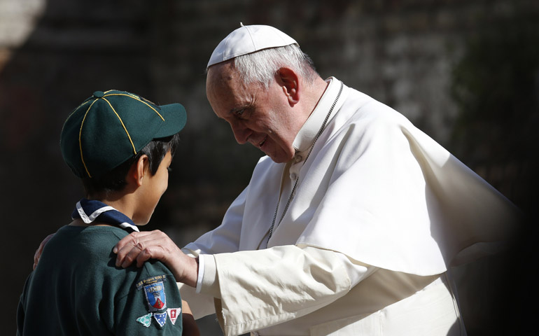 Pope Francis greets a Scout on Sunday while visiting Queen of Peace Parish in Ostia on the outskirts of Rome. (CNS/Paul Haring)