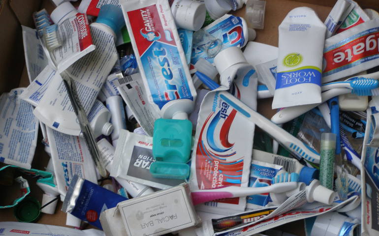 Empty toothpaste and floss containers, old toothbrushes and discarded cream tubes are among the many items that regularly fill the 96-gallon bin at St. Anthony Parish in Cincinnati through its Beyond the Bin recycling program. (Photos courtesy of Deanna Spatz)