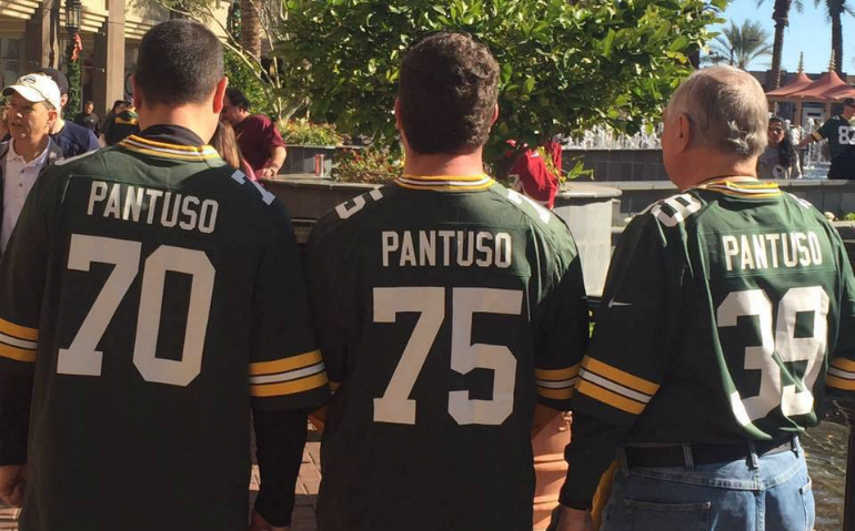 Honoring Salvatorian Fr. John Pantuso's dedication to the Green Bay Packers, his two sons, Bobby, left, and Joe, flew to Arizona for the Packer-Cardinals NFL game last Dec. 27. The Green Bay jerseys sport the men's years of birth. Arizona routed Green Bay 38-8. (Provided photo) 