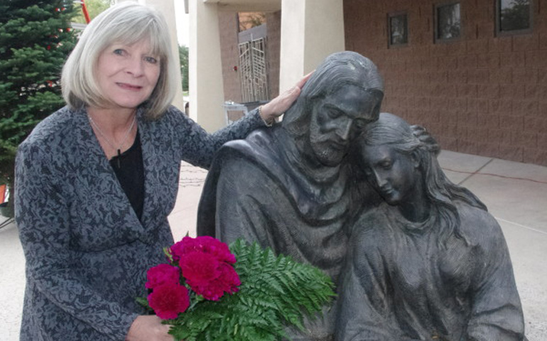 Patty Chesebrough stands near a statue at Holy Spirit Parish where Tears Speak but Spirits Soar was founded. (Photo by Joyce Coronel/Catholic Sun)