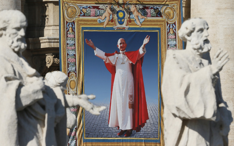 A tapestry of Blessed Paul VI hangs from the facade of St. Peter's Basilica during his beatification Mass celebrated Sunday by Pope Francis in St. Peter's Square at the Vatican. (CNS/Paul Haring)