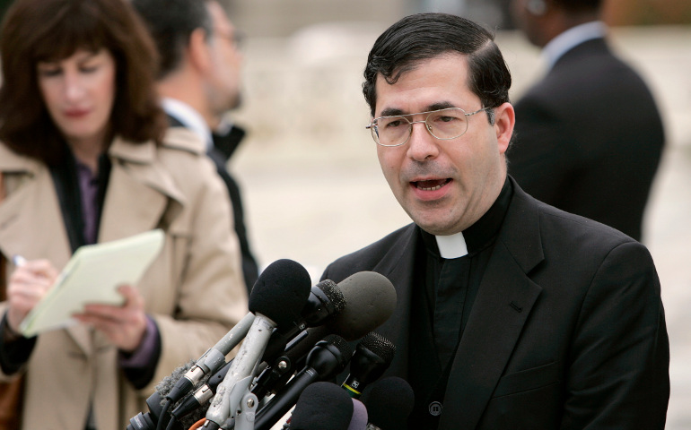 Fr. Frank Pavone speaks to the media outside the Supreme Court building in Washington in 2006. (CNS/Bob Roller)