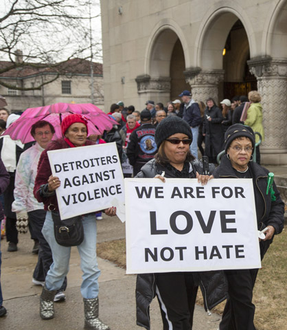 Members of Gesu Catholic Church in Detroit and residents of the surrounding neighborhood take part in a Good Friday Peace Walk on April 3. (CNS/Jim West)
