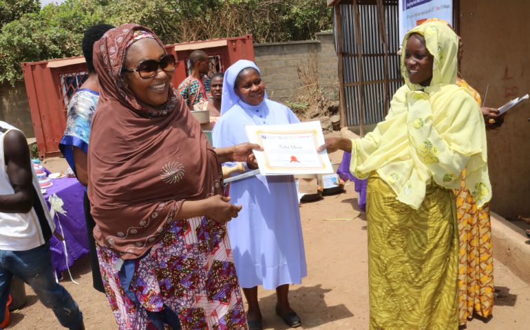 One of the participants in the Women of Faith Peacebuilding Network progam receives her certificate after the two-week empowerment course. (Courtesy of Sr. Agatha Chikelue)
