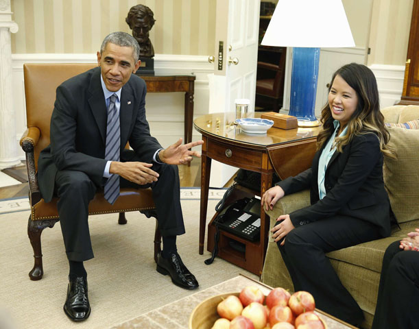 President Barack Obama with Dallas nurse Nina Pham on Oct. 24 at the Oval Office in Washington (CNS/Reuters/Larry Downing)
