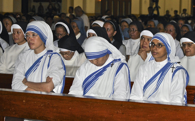 Missionaries of Charity Sisters and Missionary Benedictine Sisters of Tutzing, who suffered losses from Typhoon Haiyan in Leyte province, join the prayer service on Day of Lament and Hope on Nov. 16 led by Cardinal Luis Antonio Tagle in Paco Church. (NJ Viehland)
