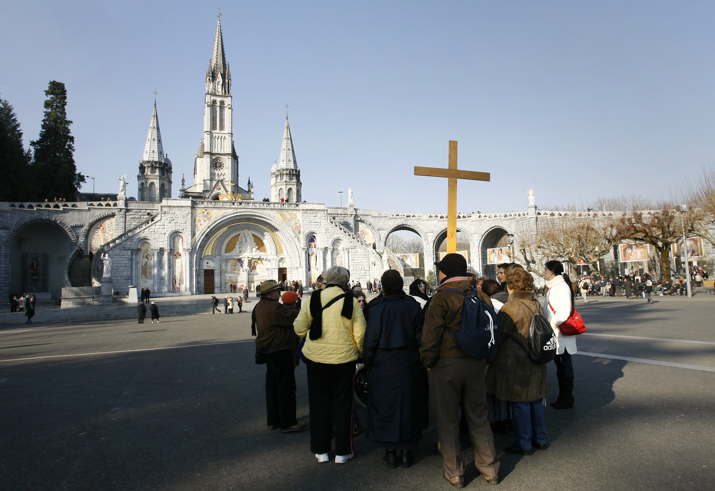 A pilgrim group gathers at the Sanctuaries of Our Lady of Lourdes in France. (CNS/Nancy Wiechec)