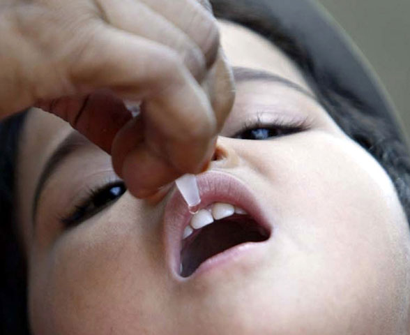 A child receives polio drops at a polio booth in the central Indian city of Bhopal in this 2008 file photo. (CNS/Reuters/Raj Patidar)