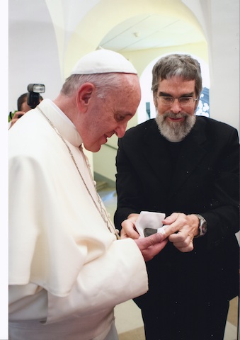 Pope Francis inspects a Mars rock with Jesuit Br. Guy Consolmagno.