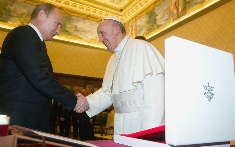 Pope Francis shakes hands with Russian President Vladimir Putin during a private audience Monday at the Vatican. (CNS/Reuters/L'Osservatore Romano)