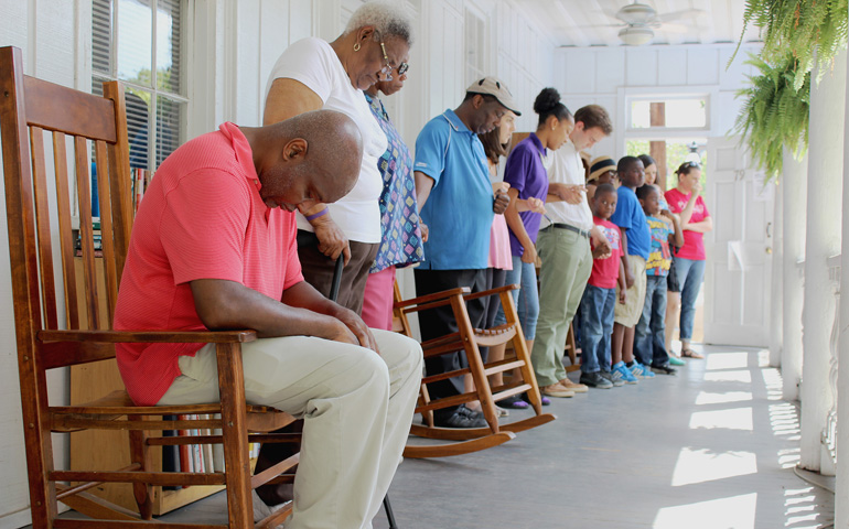 Members of the Manna Life Center lead an ecumenical prayer service June 19 at the Neighborhood House in Charleston, S.C. (CNS/The Catholic Miscellany/Victoria Wain)