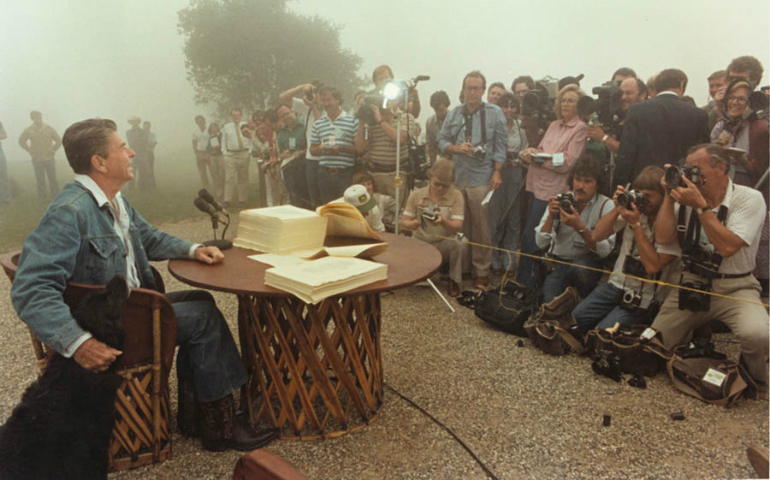 President Ronald Reagan signs the Economic Recovery Tax Act of 1981 at Rancho del Cielo, Santa Barbara, California, August 14, 1981. (White House photo, courtesy of Reagan Presidential Library)