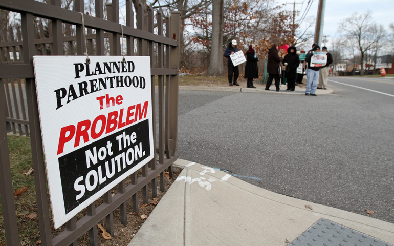 Pro-life advocates participate in a prayer vigil in January near the entrance to a Planned Parenthood clinic in Smithtown, N.Y., that performs abortions. (CNS/Gregory A. Shemitz)