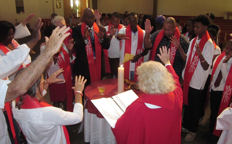 Bishop Bridget Mary Meehan prays with 16 confirmands from Good Shepherd Inclusive Catholic Community in Fort Myers, Fla.