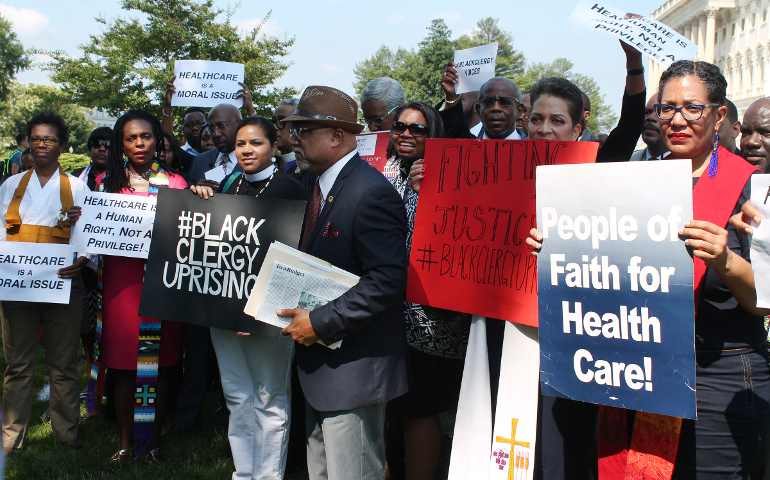 An ecumenical group of African-American clergy gathers outside the U.S. Capitol in Washington, D.C., on July 18, 2017, in opposition to the proposed budget and the health care bill. (RNS photo by Madeleine Buckley)