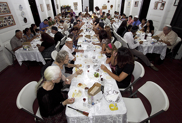 Surinamese Jews share the Passover Seder at the Neve Shalom Synagogue in Paramaribo on April 18, 2011. The Suriname Jewish community, considered as one of the oldest in the Americas, has only around 200 members. (RNS photo, courtesy of REUTERS/Ranu Abhelakh)