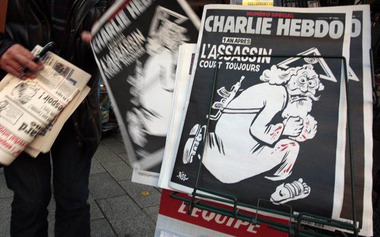 Latest edition of the French weekly Charlie Hebdo with the title “One year on, The assassin still on the run” displayed at a kiosk in Nice, France. (Eric Gaillard/Reuters)
