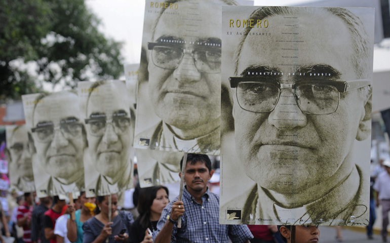 People carry large portraits of Salvadoran Archbishop Oscar Romero during a rally in late March in San Salvador to pay tribute to the late archbishop. (CNS/EPA/Roberto Escobar)