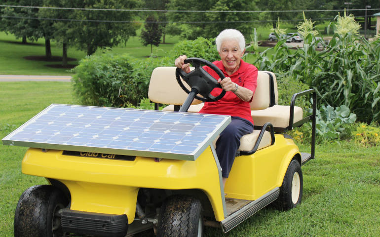Charity Sr. Paula Gonzalez and the solar car she built, "Sunny." (Photo courtesy Sisters of Charity of Cincinnati)
