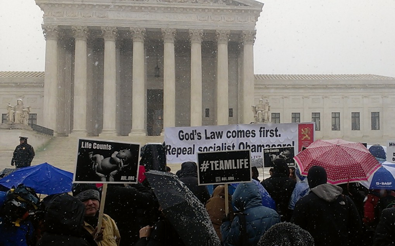 Activists outside the Supreme Court building Tuesday in Washington (NCR photo/Joshua J. McElwee)