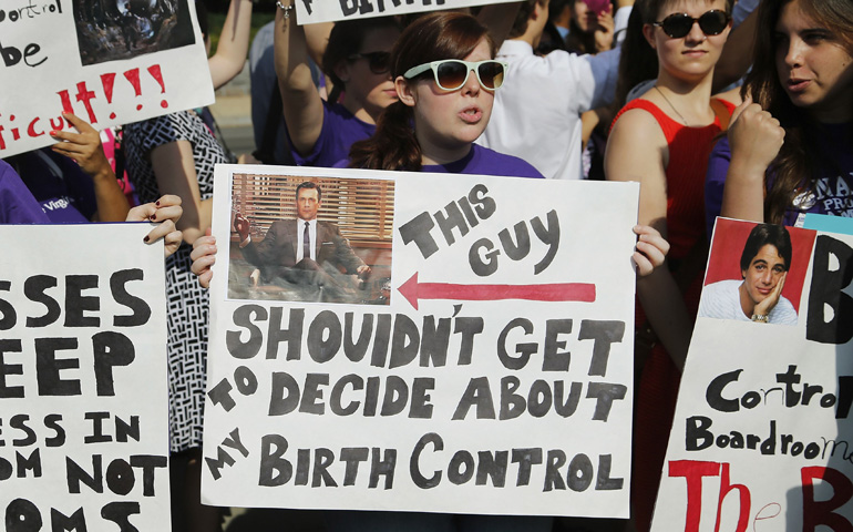 Supporters of legal abortion and the federal contraceptive mandate demonstrate Monday outside the U.S. Supreme Court in Washington. (CNS/Reuters/Jonathan Ernst) 