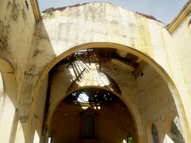 A bombed-out church adjoining the Good Shepherd Peace Center about 10 miles southwest of Juba, South Sudan, serves as a sober reminder of the country’s legacy of war. (NCR photo/Chris Herlinger)