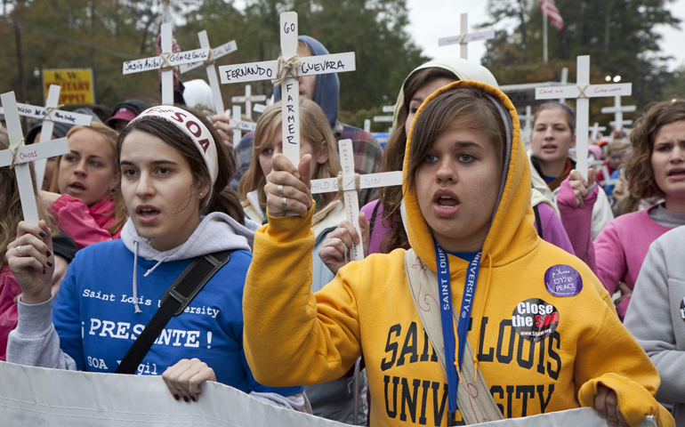 Young people rally at the gates of the Western Hemisphere Institute for Security Cooperation on Nov. 22, 2009, at Fort Benning, near Columbus, Ga. (CNS/Jim West)