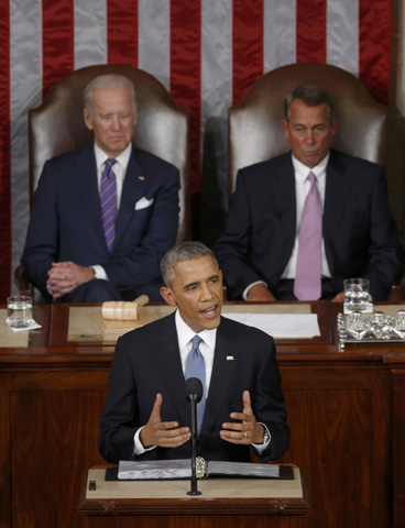U.S. Vice President Joe Biden and House Speaker John Boehner, R-Ohio, look on as President Barack Obama delivers his State of the Union address Tuesday in front of the U.S. Congress on Capitol Hill in Washington. (CNS/Reuters/Kevin Lamaquer)