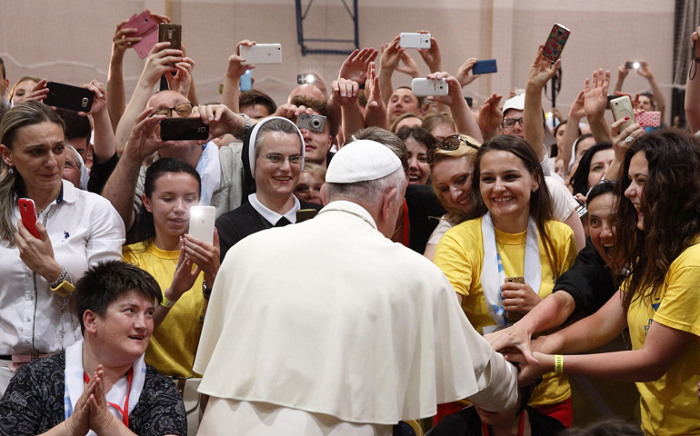 Pope Francis greets young people during a meeting with them Saturday at the diocesan John Paul II Youth Center in Sarajevo, Bosnia-Herzegovina. (CNS/Paul Haring)
