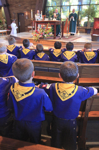 Cub Scouts stand as Bishop W. Francis Malooly of Wilmington, Del., celebrates Mass  in 2010 during the Religious Scout Awards at Church of the Holy Child in Wilmington. (CNS/The Dialog/Don Blake)